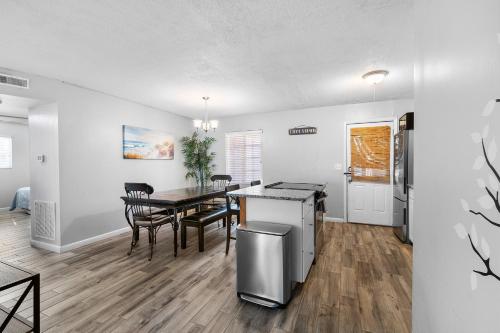 a kitchen and dining room with a table and chairs at Amazing, Oasis, Mins from the beach and Charleston, Free Wine in Charleston