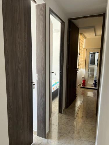 a hallway with two open doors and a hallway with a hallway at Apartamento Nogales in Bello