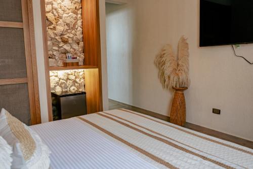 Кровать или кровати в номере La Gracia Hotel & Spa
