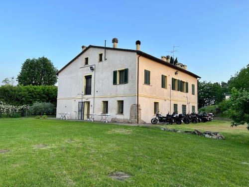 a group of motorcycles parked in front of a building at R&B Del Monte in Forlì