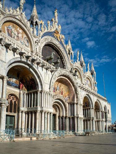 a large building with statues on the side of it at San Marco Loft in Venice