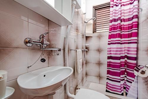a bathroom with a sink and a toilet and a shower at Holiday Home Gradina, Island of Korčula in Vela Luka