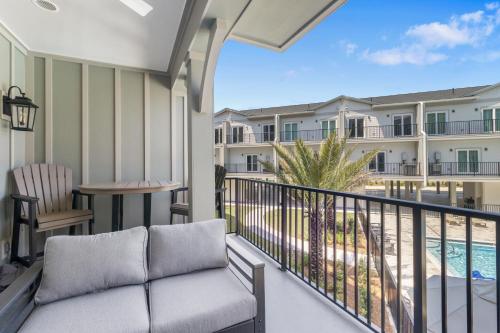 a balcony with a couch and a view of a resort at Gus Getaway by Pristine Properties Vacation Rentals in Highland View