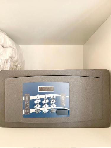 a television with a remote control on top of it at B&B Le Saline in Taranto