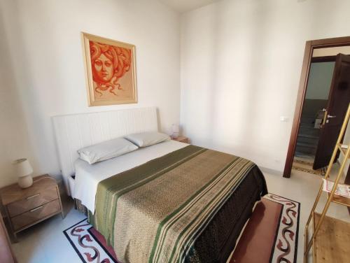 Ένα ή περισσότερα κρεβάτια σε δωμάτιο στο Palazzo Orangea 2 piano