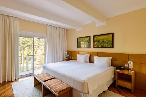 Katil atau katil-katil dalam bilik di Grande Hotel Campos do Jordao