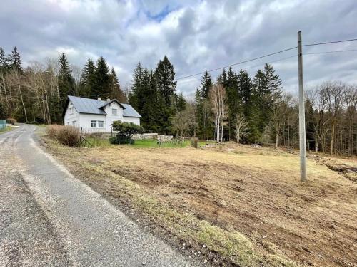 a house sitting on the side of a road at Vila 100klasa in Nejdek