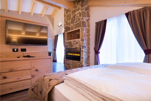 Voodi või voodid majutusasutuse Chalet Marcora toas
