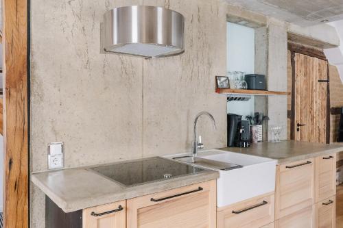 a kitchen with a sink and a counter at Alte Schreinerei in Monschau