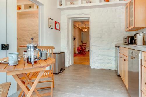a kitchen with a table and a counter top at Historical Thurmont Escape with Furnished Deck! in Thurmont