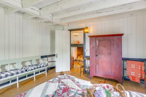 a room with two beds and a red door at Historical Thurmont Escape with Furnished Deck! in Thurmont