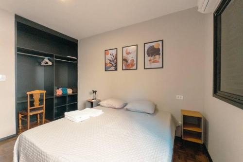 Ένα ή περισσότερα κρεβάτια σε δωμάτιο στο Excelente Apartamento Centro - MJ20