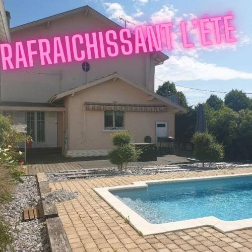 a house with a swimming pool in front of it at Ateka Dax in Dax