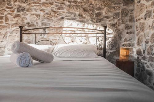 Ένα ή περισσότερα κρεβάτια σε δωμάτιο στο Nephèle - The Embrace of Hospitality