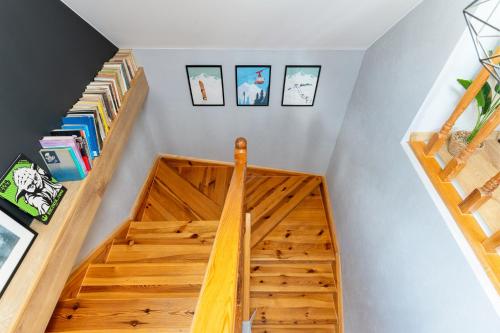 a staircase with wooden treads in a house at Dablin 9 in Korbielów
