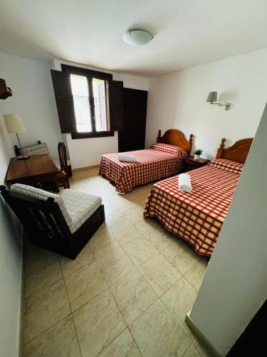 Postel nebo postele na pokoji v ubytování La Casona de Arona