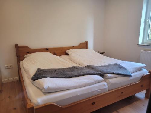 Postel nebo postele na pokoji v ubytování Reload Apartments - FeWo3 im Remmeker Feld