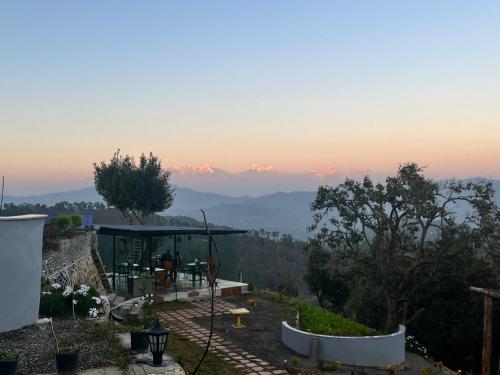 a house with a view of the mountains at Himadvaya- The Himalayan Prism in Almora