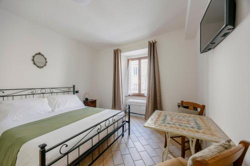 Postel nebo postele na pokoji v ubytování La Cattedrale Rooms