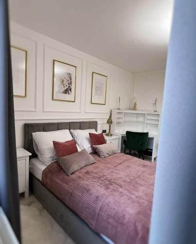Ένα ή περισσότερα κρεβάτια σε δωμάτιο στο Apartament Lumière