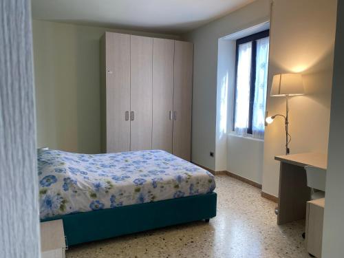 a bedroom with a bed and a dresser and a window at Holiday Home in Belmonte del Sannio