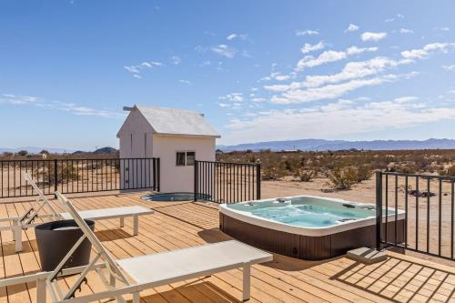 a deck with a hot tub on top of a house at Shangrila By The Cohost Company in Joshua Tree