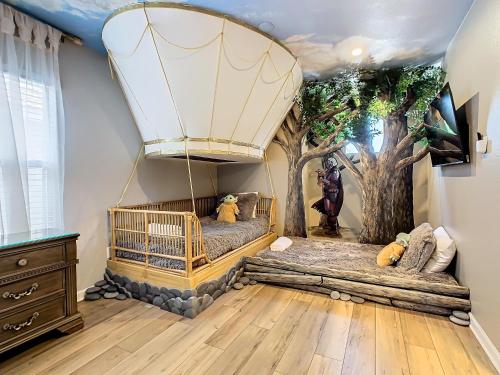 a room with two beds and a balloon at WH7820BS - 5 bedrooms - Pool - Theater - Resort in Orlando