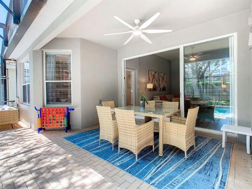 a dining room with a table and chairs at WH7820BS - 5 bedrooms - Pool - Theater - Resort in Orlando