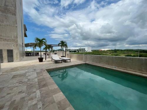 Bazén v ubytování SERENA Departamento en Marina Platino nebo v jeho okolí