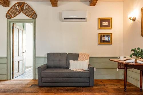 a living room with a couch and a table at The Mohawk Valley House - 4 suite boutique hotel renamed in Bellmead