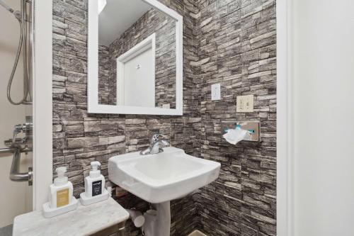 a bathroom with a sink and a mirror at Sonesta Essential Vacaville Napa Valley in Vacaville