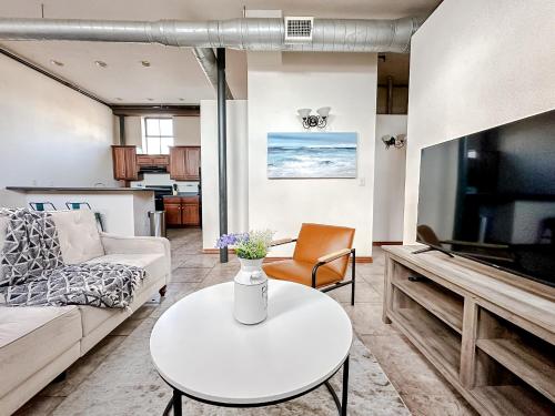 a living room with a couch and a table at Sleepover 2BD 1BA Condos Downtown Springfield in Springfield