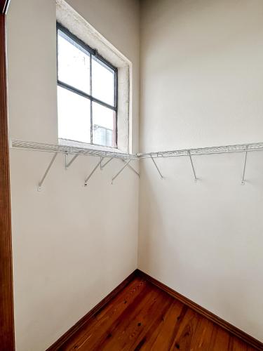 an empty room with a window and shelves at Sleepover 2BD 1BA Condos Downtown Springfield in Springfield