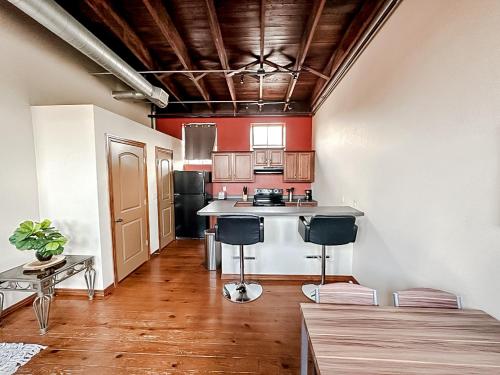 a kitchen with a table and a counter in a room at Sleepover 2BD 1BA Condos Downtown Springfield in Springfield