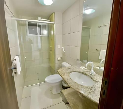 a bathroom with a sink and a toilet at MoviHosts Terrazzo in Natal