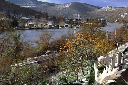 a view of a river with snow on the ground at Mountains Apartment Elb Canyon in Ústí nad Labem