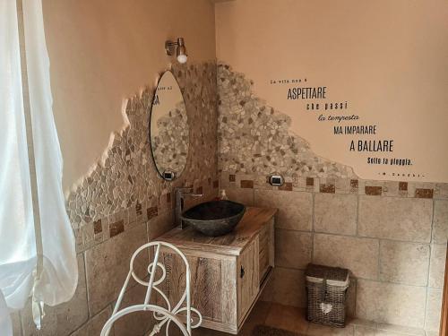 a bathroom with a sink and a mirror at Villa Le Cicale - Irpinia in Prata di Principato Ultra