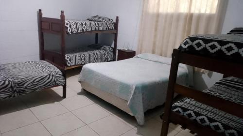 Ένα ή περισσότερα κρεβάτια σε δωμάτιο στο Casa con pileta San Luis Juana Koslay