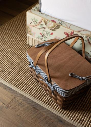a brown purse sitting on top of a table at Le Petit Pali Brentwood in Los Angeles