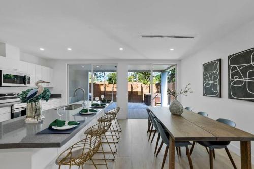 a kitchen and dining room with a table and chairs at Up to 12 guest Modern Villa near Wynwood! 27 in Miami