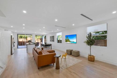 a living room with a couch and a table at Up to 12 guest Modern Villa near Wynwood! 27 in Miami