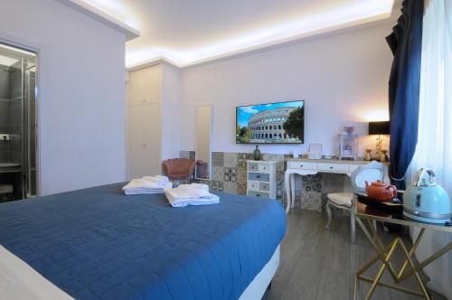 a bedroom with a blue bed and a desk at RomAntic Dreams Guest House in Rome