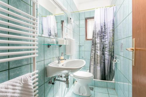 a bathroom with a sink and a toilet at Apartments by the sea Postira, Brac - 739 in Postira