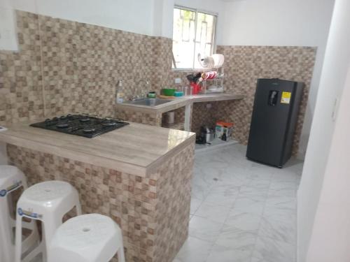 Η κουζίνα ή μικρή κουζίνα στο Apartahotel Bahia Gaira