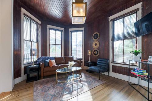 a living room with a couch and a table at Plum house in Galveston