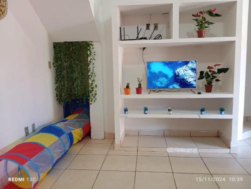 Et tv og/eller underholdning på Casa de Praia Figueiredo