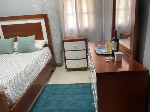 Ένα ή περισσότερα κρεβάτια σε δωμάτιο στο apartamento 3 habitaciones 15 minutos aeropuerto las america