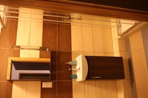 a paper towel dispenser on the wall of a bathroom at Noclegi Andersa in Wałbrzych