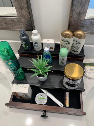 a shelf with products on it in a bathroom at Brand New Home in Moor in Moore