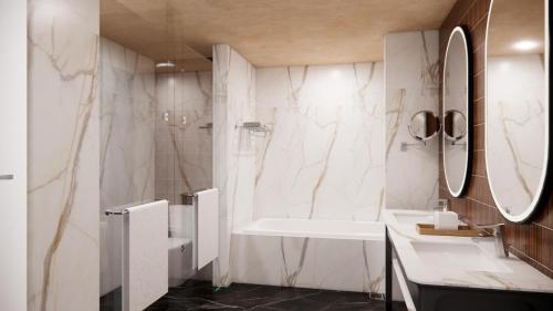 a white bathroom with a sink and a shower at Mercure Garut City Center in Garut